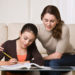 Woman Helping Daughter with Homework