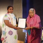 Shri Sorath Mahila Vikas Sahkari Samitis director Motiben Chavda left receives the award from social worker Sindhutai Sapkal