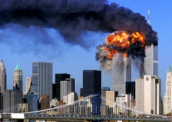 SEVENTH IN A PACKAGE OF NINE PHOTOS.-- An explosion rips through the  South Tower of the World Trade Towers after the hijacked United Airlines Flight 175, which departed from Boston en route for Los Angeles, crashed into it Sept, 11, 2001. The North Tower is shown burning after American Airlines Flight 11 crashed into the tower at 8:45 a.m.